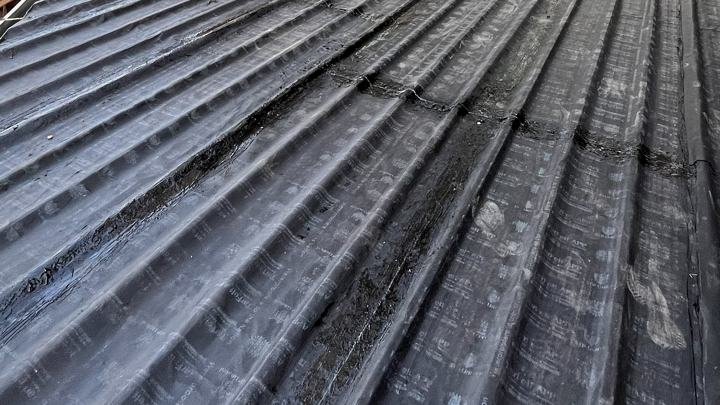 Detail of membrane laps on a corrugated roof