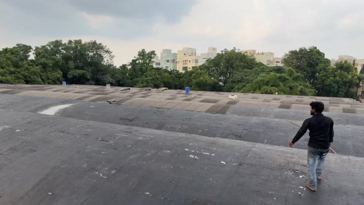 Large flat roof waterproofing under inspection